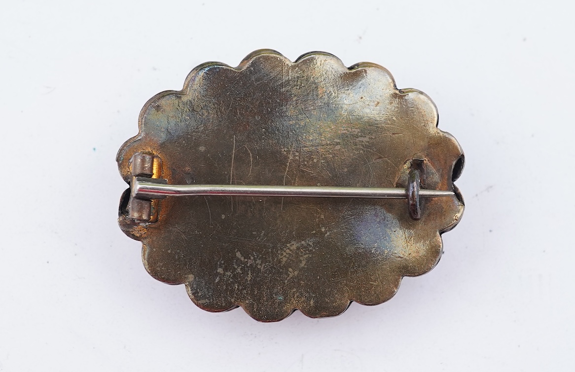 A group of gilt metal/pinchbeck jewels, 19th and early 20th century, comprising: a brooch of knotted design; two gate bracelets; a fancy link bracelet; an open-faced pocket watch; two oval panel brooches, and two watch c